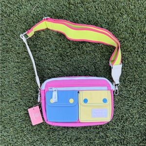 Vibrant Pink Crossbody Bag with Blue and Yellow Accents